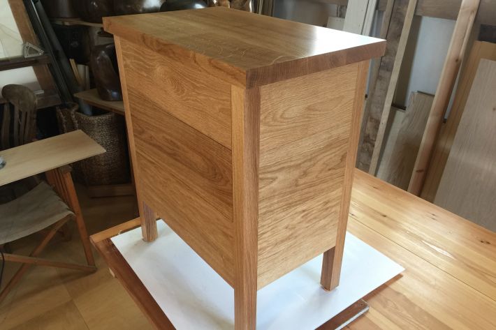 A chest of drawers or occasional seat